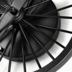 Załaduj obraz do przeglądarki galerii, Close view of the black wagon wheel backplate and spoke detail