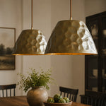Cargar imagen en el visor de la Galería, Pair of hammered brass pendant lights above a dining table