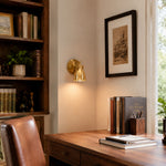 Załaduj obraz do przeglądarki galerii, Brass wall lamp installed in a warm interior