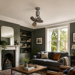 Carica l'immagine nella visualizzazione Galleria, Compact ceiling fan in a green living room with sofa and fireplace