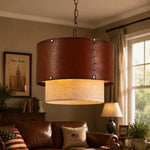 Cargar imagen en el visor de la Galería, Brown leather drum pendant light in a warm living room setting
