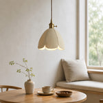 Cargar imagen en el visor de la Galería, Natural leather petal pendant light beside a bright table setting