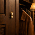 Afbeelding laden in galerijweergave, Brass rabbit cabinet knob on a wooden wardrobe door