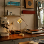 Cargar imagen en el visor de la Galería, Cream floral table lamp lit on a desk beside coffee and record equipment