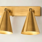 Bild in die Galerieansicht laden, Close view of two brass adjustable cone shades with warm light