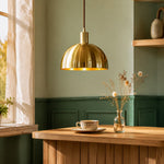Load image into Gallery viewer, Brushed brass half dome pendant light against a green wall