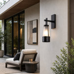 Cargar imagen en el visor de la Galería, Vintage black outdoor wall lantern in a covered exterior setting 2