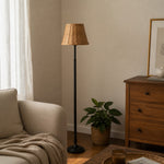 Afbeelding laden in galerijweergave, Rattan shade floor lamp in a warm bedroom corner