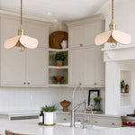 Cargar imagen en el visor de la Galería, Leather petal pendant lights over a bright kitchen island