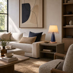 Afbeelding laden in galerijweergave, Sculptural ceramic table lamp beside a neutral sofa
