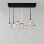 Load image into Gallery viewer, Lumivelle Sculptural 7-Light Chandelier – Adjustable Height Modern Glass Pendant