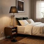Załaduj obraz do przeglądarki galerii, Black floor lamp beside a bedroom nightstand