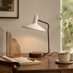 Bild in die Galerieansicht laden, Japanese iron desk lamp beside books and a cup on a wooden study desk