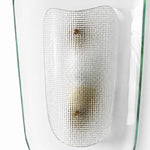 Afbeelding laden in galerijweergave, Front detail of clear glass wall sconce with textured inner shade
