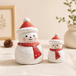 Carica l'immagine nella visualizzazione Galleria, Two wooden snowman ornaments styled with holiday decor