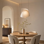 Load image into Gallery viewer, Pleated fabric pendant light in a warm dining room