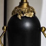 Charger l'image dans la visionneuse de la galerie, Close-up of matte black lamp body with antique brass-toned floral detail
