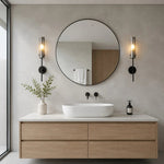 Carica l'immagine nella visualizzazione Galleria, Black copper alabaster wall sconces installed beside a round bathroom mirror