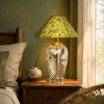 Load image into Gallery viewer, Floral glass table lamp on a wooden bedside table