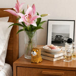 Załaduj obraz do przeglądarki galerii, Small wooden lion figurine styled on a bedside table