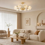 Załaduj obraz do przeglądarki galerii, Ten-arm floral glass chandelier installed in a bright living room