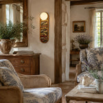 Załaduj obraz do przeglądarki galerii, Vintage fabric wall sconce in a warm living room
