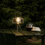 Cargar imagen en el visor de la Galería, Solar garden lantern glowing on an outdoor table at night