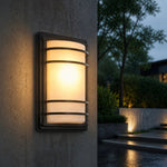 Załaduj obraz do przeglądarki galerii, Outdoor wall light glowing on a wet exterior wall