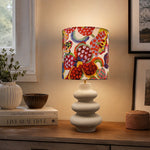 Bild in die Galerieansicht laden, Floral fabric shade ceramic table lamp on a side table