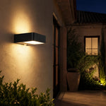 Załaduj obraz do przeglądarki galerii, Style A outdoor wall lamp casting warm light on an exterior wall