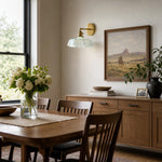 Afbeelding laden in galerijweergave, Blue milk glass brass wall sconce in a dining room