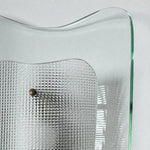 Afbeelding laden in galerijweergave, Close view of clear glass wall sconce and textured inner shade