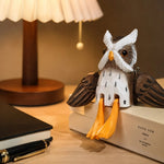 Carica l'immagine nella visualizzazione Galleria, Hand-carved wooden hanging-leg owl ornament styled on a tabletop edge