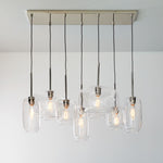Load image into Gallery viewer, Lumivelle Sculptural 7-Light Chandelier – Adjustable Height Modern Glass Pendant