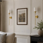 Załaduj obraz do przeglądarki galerii, Natural brass wall sconce in a corner setting
