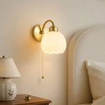 Afbeelding laden in galerijweergave, Milk glass flower wall lamp in a calm bedside setting