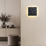 Cargar imagen en el visor de la Galería, Ivory carved travertine wall sconce installed on a neutral wall