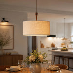 Bild in die Galerieansicht laden, Natural linen drum pendant lamp above a dining table