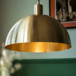 Load image into Gallery viewer, Close view of rolled brass shade edge and brushed texture