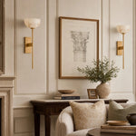 Załaduj obraz do przeglądarki galerii, Natural brass wall sconces beside framed art