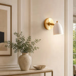Załaduj obraz do przeglądarki galerii, White and gold wall sconce installed beside artwork