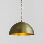 Load image into Gallery viewer, Aged brass half dome pendant with chain suspension 40 cm