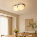Cargar imagen en el visor de la Galería, Cream travertine ceiling lamp above a dining table