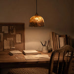 Cargar imagen en el visor de la Galería, Paper pendant light above a warm reading desk