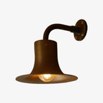 Cargar imagen en el visor de la Galería, Antique brass wall sconce with warm bulb glow