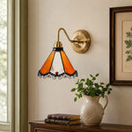 Cargar imagen en el visor de la Galería, Orange stained glass wall sconce on a framed art wall