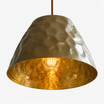Cargar imagen en el visor de la Galería, Close-up of the warm golden interior and bulb under the brass shade