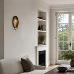 Afbeelding laden in galerijweergave, Sculptural wall sconce in a bright living room