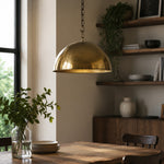 Load image into Gallery viewer, Antique brass dome pendant in a dining room