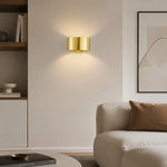 Afbeelding laden in galerijweergave, Gold brass wall sconce installed in an interior